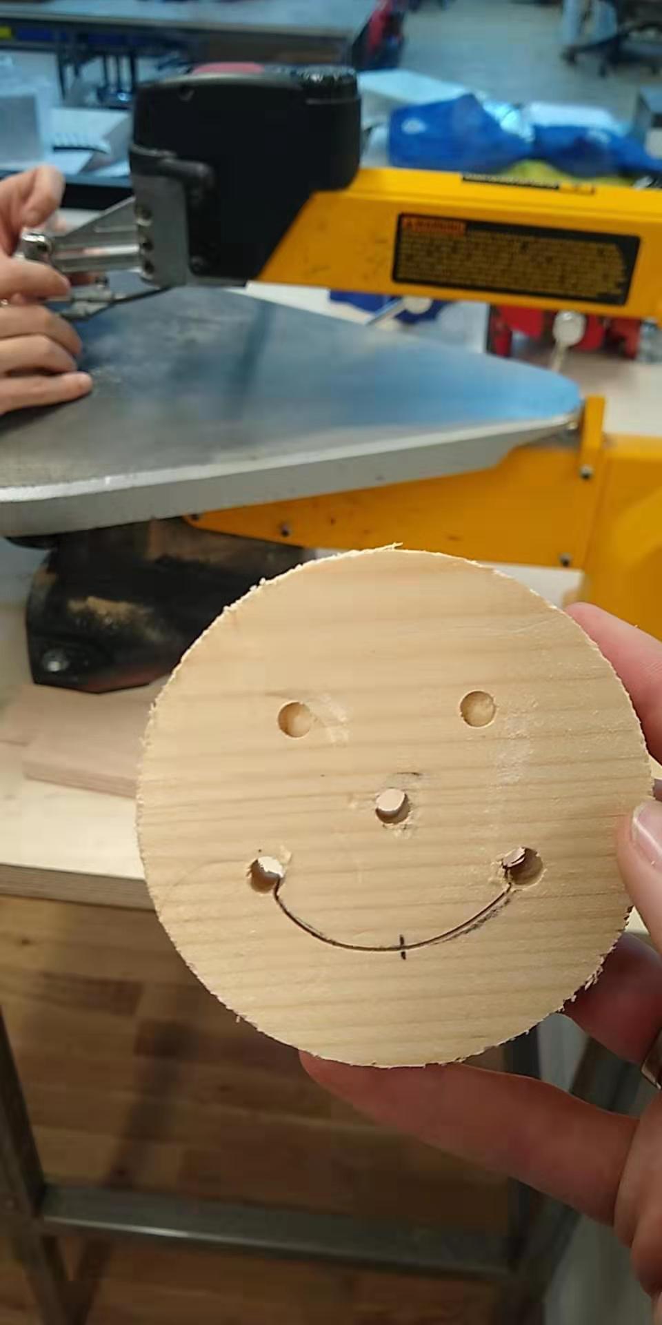 A smiley with a line sawed through for the mouth.